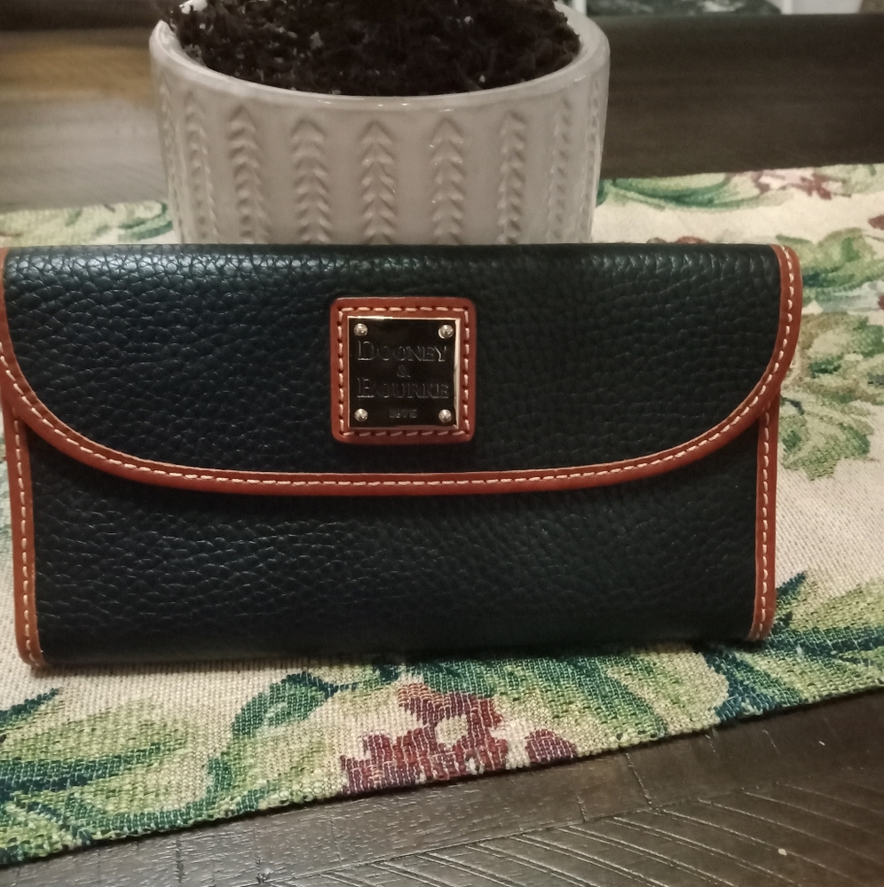 Dooney & Bourke Black Pebble leather wallet with brown leather trim.